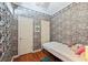 Unique bedroom with whimsical wallpaper, decorative trim and wood floors at 3000 Cathedral Pl, Decatur, GA 30034