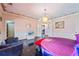Spacious bedroom with a round bed, stylish chandelier, and black tile floor at 3000 Cathedral Pl, Decatur, GA 30034