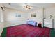 Bedroom with a ceiling fan, patterned rug, and ample natural light at 3000 Cathedral Pl, Decatur, GA 30034