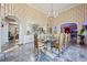 Spacious dining room featuring a glass table, ornate chairs, and access to other rooms through grand archways at 3000 Cathedral Pl, Decatur, GA 30034