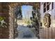 Stone archway provides a glimpse of the manicured yard at 3000 Cathedral Pl, Decatur, GA 30034