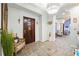 Inviting foyer featuring tiled floor, chandelier and view to the front door at 3000 Cathedral Pl, Decatur, GA 30034