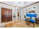 Bright foyer with chandelier, dark stained wood doors and travertine tile floors at 3000 Cathedral Pl, Decatur, GA 30034