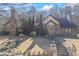 Charming stone and brick home with manicured front yard, mature trees, and a fountain at 3000 Cathedral Pl, Decatur, GA 30034