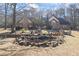 Stunning front exterior showcasing a stone facade, picturesque pond, and meticulous landscaping at 3000 Cathedral Pl, Decatur, GA 30034