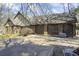 Charming brick home with a three-car garage, mature trees, and a spacious driveway at 3000 Cathedral Pl, Decatur, GA 30034
