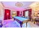 Opulent game room featuring a pool table, elaborate ceiling details and rich red draperies at 3000 Cathedral Pl, Decatur, GA 30034