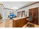 Kitchen island featuring granite countertops, wood cabinets, and seating at 3000 Cathedral Pl, Decatur, GA 30034