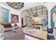 Open concept living room featuring chandeliers, tiled floors, and ornate furniture at 3000 Cathedral Pl, Decatur, GA 30034