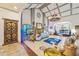 Open living room with vaulted ceiling, fireplace, and ornate furnishings and decor at 3000 Cathedral Pl, Decatur, GA 30034