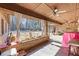 Back porch with ceiling fans, brick accents, and a view of the backyard at 3000 Cathedral Pl, Decatur, GA 30034
