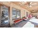 Spacious covered patio with brick accents, ceiling fans, and outdoor seating at 3000 Cathedral Pl, Decatur, GA 30034