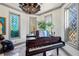 Piano Room featuring leaded glass windows and a dark wood piano with sheet music at 3000 Cathedral Place, Decatur, GA 30034