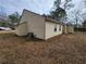 A view of the home's backyard with vinyl siding and central air conditioning unit at 104 Westland Sw Ct, Marietta, GA 30064