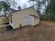 View of the rear of the home with vinyl siding and multiple doors to the outside at 104 Westland Sw Ct, Marietta, GA 30064