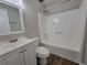 Bathroom featuring a vanity with wood-look floors, a shower, and tub combination at 104 Westland Sw Ct, Marietta, GA 30064