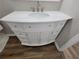 Vanity in bathroom featuring a white countertop, drawers, and cabinets with wooden-look floors at 104 Westland Sw Ct, Marietta, GA 30064