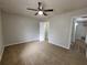 Bright bedroom featuring neutral walls and plush carpet, with views of a walk-in closet at 104 Westland Sw Ct, Marietta, GA 30064