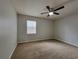 Bright bedroom featuring neutral walls, plush carpet, and a ceiling fan at 104 Westland Sw Ct, Marietta, GA 30064