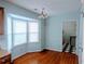 Breakfast nook featuring a bay window with hardwood floors and blue walls at 11006 Clearwater Dr, Hampton, GA 30228