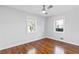 Bedroom features hardwood floors, ceiling fan, white paint, and natural light at 1889 Cannon St, Decatur, GA 30032