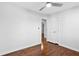 Bedroom featuring hardwood floors, white trim, ceiling fan and two paneled doors at 1889 Cannon St, Decatur, GA 30032