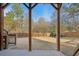 Backyard patio with covered patio, a spacious lawn, and mature trees at 5305 Redfield Way, Cumming, GA 30028