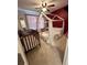 Bedroom featuring a crib, a canopy bed, and neutral carpet at 5305 Redfield Way, Cumming, GA 30028