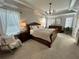 Serene bedroom with trey ceilings, neutral colors, and plush carpet creating a relaxing retreat at 5305 Redfield Way, Cumming, GA 30028