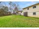 View of the home's backyard highlighting the spacious lawn, deck, and the home's exterior at 72 Diane Ct, Dallas, GA 30157