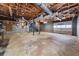 Spacious unfinished basement with exposed ceiling, grey concrete walls, and natural lighting at 72 Diane Ct, Dallas, GA 30157