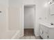 A bathroom with a tub/shower combo, neutral tile floors, and a white sink at 72 Diane Ct, Dallas, GA 30157