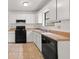 Functional kitchen featuring white cabinetry and essential appliances at 72 Diane Ct, Dallas, GA 30157