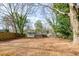 Backyard with plenty of greenery surrounding the property at 1467 Lockwood Sw Dr, Atlanta, GA 30311