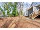 Spacious backyard with wooden deck and privacy fence on the side at 1467 Lockwood Sw Dr, Atlanta, GA 30311