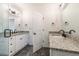 Bathroom with dual granite vanities and modern fixtures at 1467 Lockwood Sw Dr, Atlanta, GA 30311