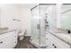 Bathroom with double vanities, granite countertops, and a tiled shower at 1467 Lockwood Sw Dr, Atlanta, GA 30311