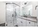 Modern bathroom featuring a glass-enclosed shower and granite countertops at 1467 Lockwood Sw Dr, Atlanta, GA 30311