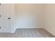 Empty bedroom with neutral carpeting, white trim, and plenty of light at 1467 Lockwood Sw Dr, Atlanta, GA 30311