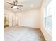 Spacious bedroom with neutral carpeting, ceiling fan, and ensuite bathroom at 1467 Lockwood Sw Dr, Atlanta, GA 30311