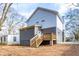 Back of the home features a walkout deck and gray vinyl siding at 1467 Lockwood Sw Dr, Atlanta, GA 30311