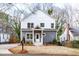 Charming two-story home with a welcoming front porch and attractive gray and white exterior at 1467 Lockwood Sw Dr, Atlanta, GA 30311