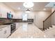 Bright kitchen features stainless steel appliances, white cabinetry, granite countertops and an island at 1467 Lockwood Sw Dr, Atlanta, GA 30311