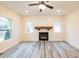 Bright living room with hardwood floors, recessed lighting, a modern fireplace, and large windows at 1467 Lockwood Sw Dr, Atlanta, GA 30311