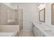 Contemporary bathroom featuring a glass-enclosed shower, soaking tub, and double sink vanity at 2360 Elgar Park Pl # 99, Duluth, GA 30096