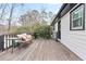 Wooden back deck offers a relaxed outdoor space with seating, perfect for enjoying the surrounding greenery at 2720 Creekview Nw Pt, Marietta, GA 30064