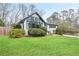 Exterior view of a home with a well-kept lawn and unique window design and black trim at 2720 Creekview Nw Pt, Marietta, GA 30064