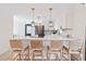 Kitchen island with bar seating, white countertops, and modern pendant lighting at 2720 Creekview Nw Pt, Marietta, GA 30064