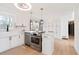 Bright kitchen featuring stainless steel appliances, white cabinets, and a farmhouse sink at 2720 Creekview Nw Pt, Marietta, GA 30064