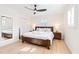 Bright main bedroom with wood flooring, a modern ceiling fan, and a large window with plantation shutters at 2720 Creekview Nw Pt, Marietta, GA 30064